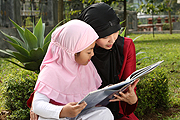 mom and girl reading a book